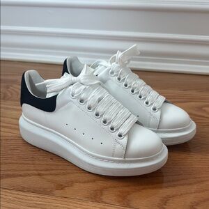 Alexander McQueen oversized sneaker.White Platform Sneakers w/ Black Heel Accent